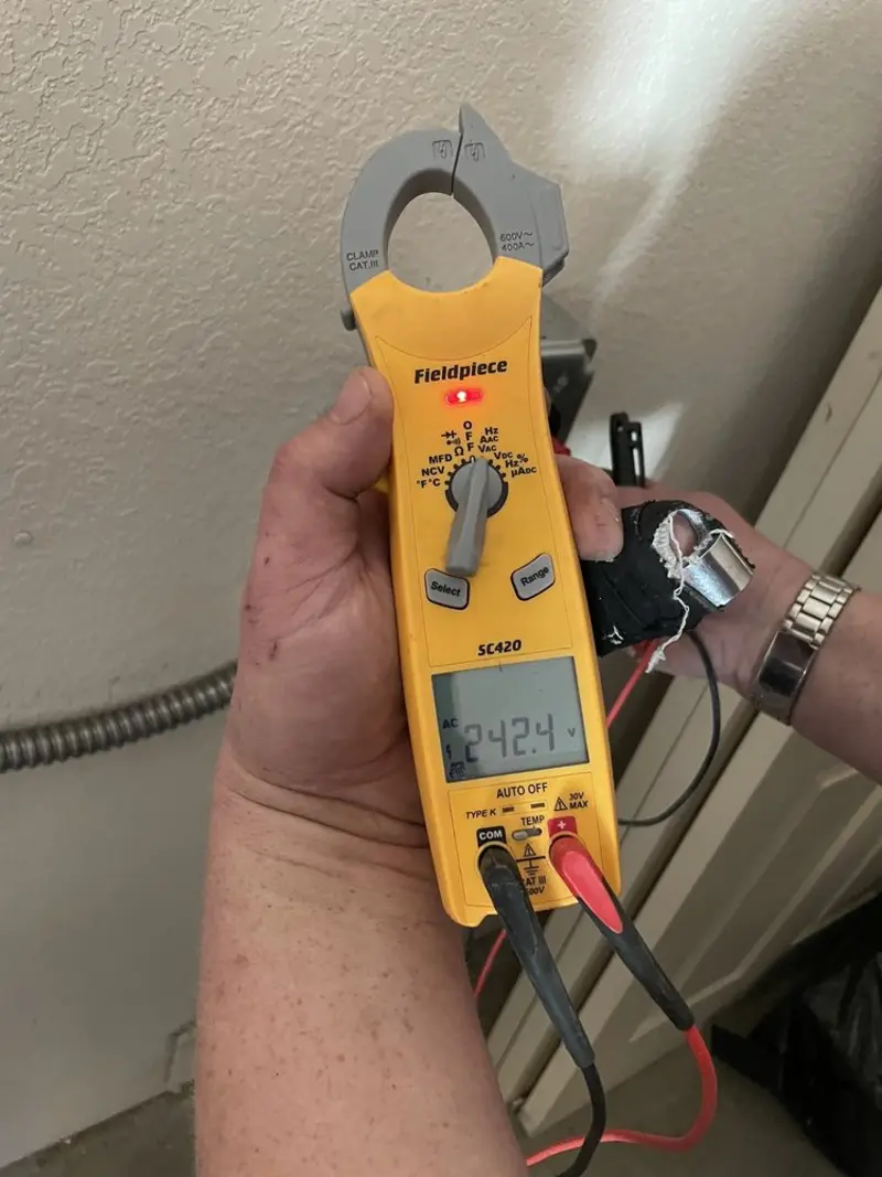 Voltage testing with clamp meter during Whole House Surge Protector in West View